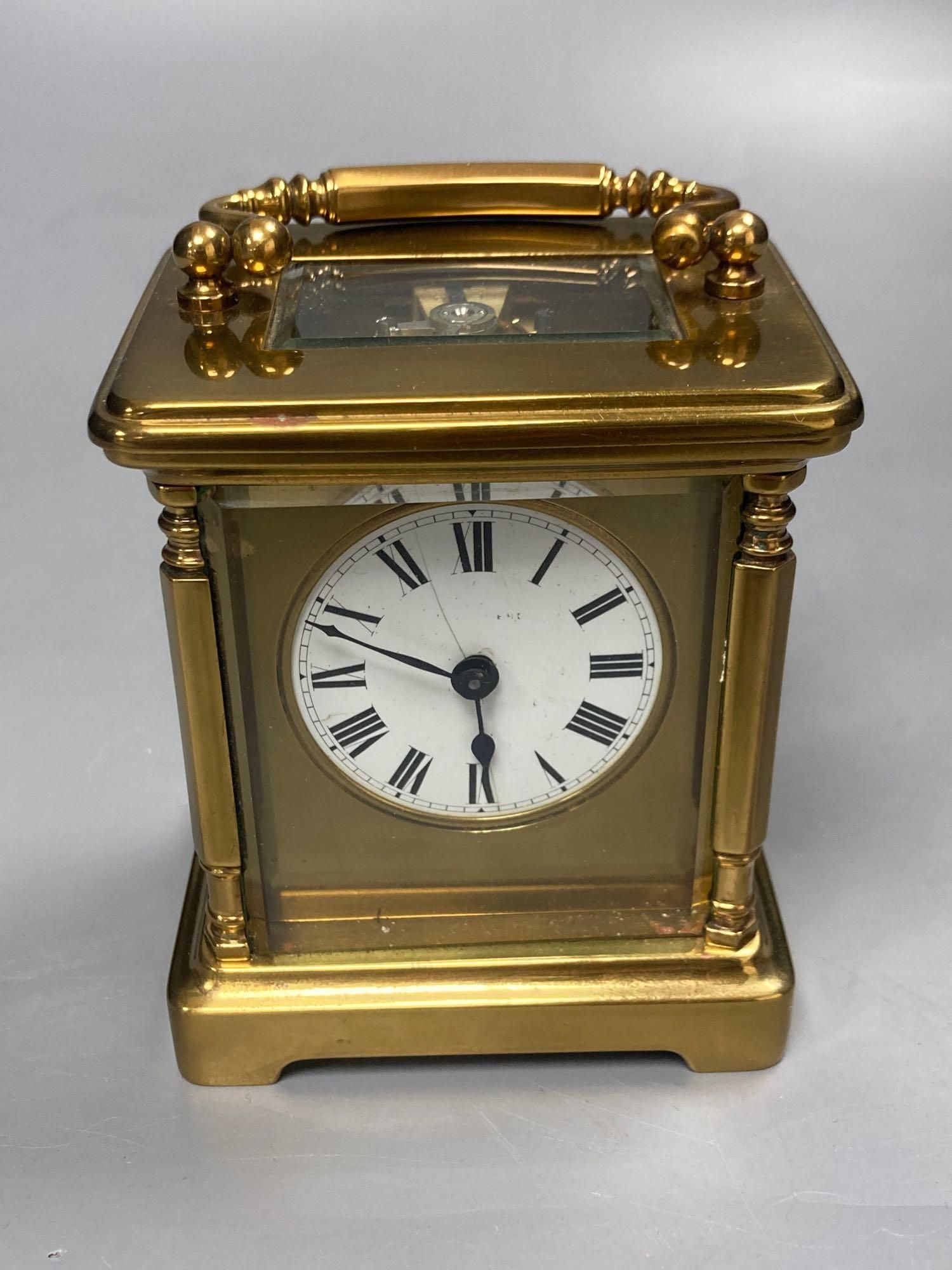 A late 19th century French brass carriage timepiece, 13cm high to handle